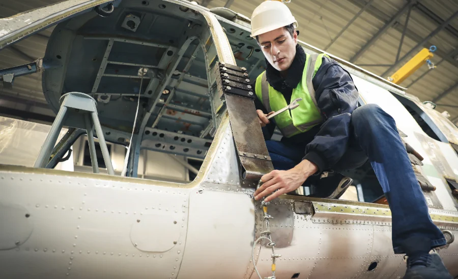 Portrait of a Caucasian man , factory engineer in work clothes c