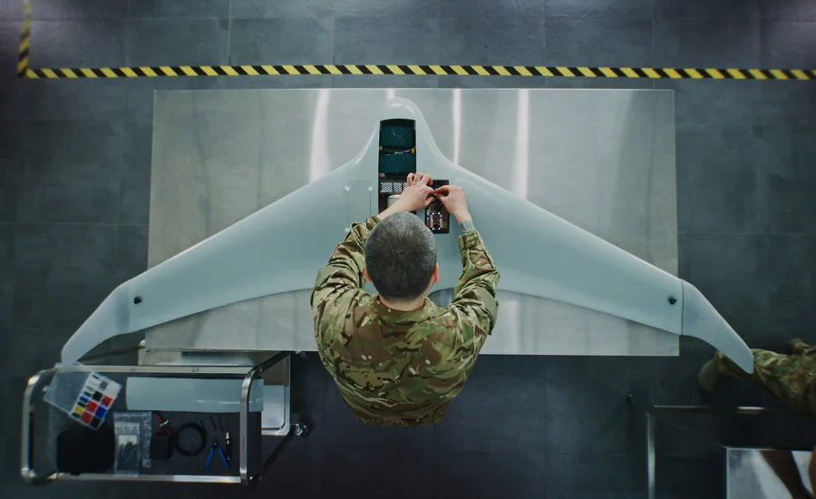 Engineer in Military Uniform Assembling Unmanned Aerial Vehicle