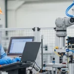 Engineer Operating Robotic Arm in Modern Factory Setting.