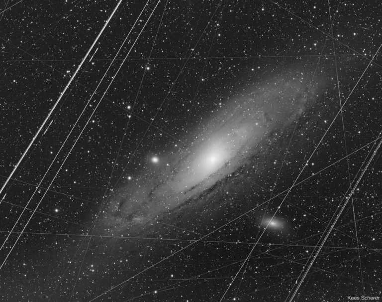 the-andromeda-galaxy-a-celestial-spectacle-revealed-through-the-lens-of-earthly-imperfections